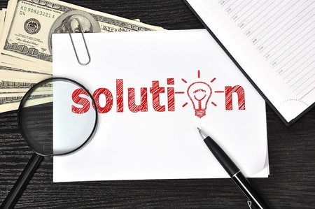 poster with solution sign and money in the officeの写真素材