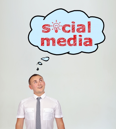 businessman and speech bubbles with social media over headの写真素材