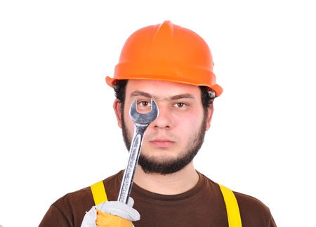 builder holding wrench on a white background