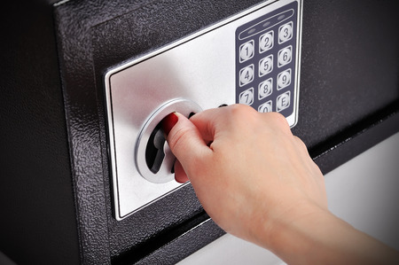 woman hand opened a safe, close up