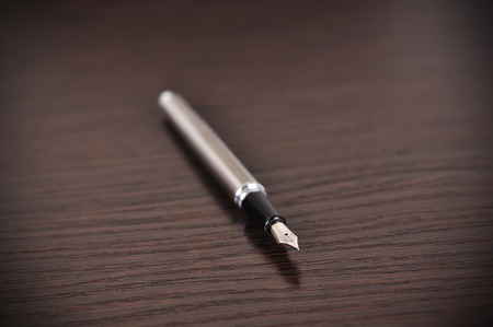 fountain pen on wooden tableの写真素材
