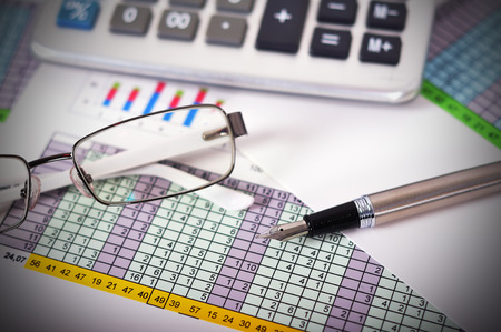 Business concept with documents, calculator and  fountain pen