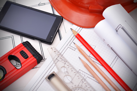 blueprint, phone and tools on the desktop, workspace engineer