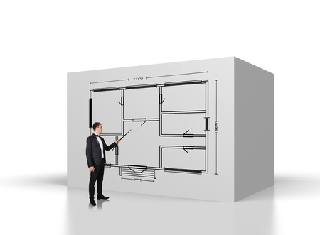 businessman points on the pointer to drawing blueprintの写真素材