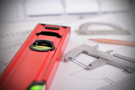 Tools and papers with sketches blueprint  on the table