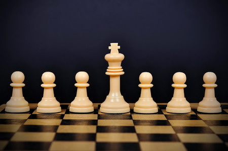 White Chess King and pawns on chessboardの写真素材