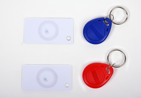 two RFID cards and keychain on a white background