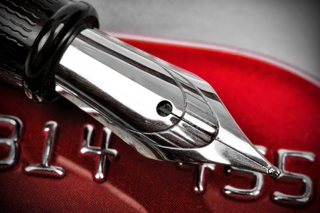 ink pen and number of credit cardの写真素材