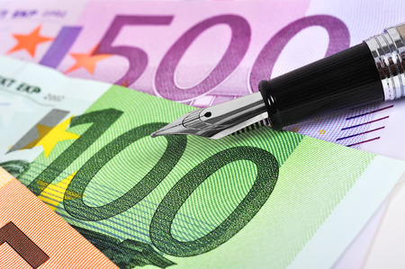 Euro banknotes and ink pen, close upの写真素材