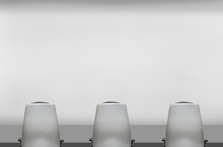 three chair and table in concrete officeの写真素材