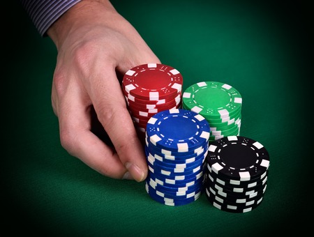 dealer hands out poker chips, close up