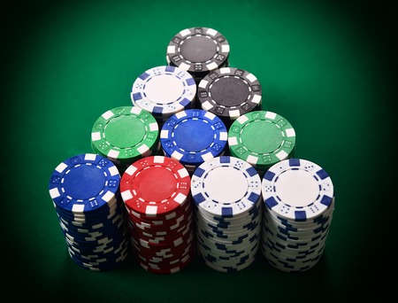 stack of poker chips on green table
