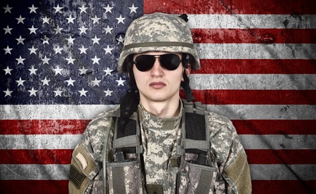 american soldier and USA flag on background