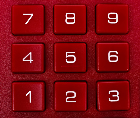 number on red calculator, extra close upの写真素材