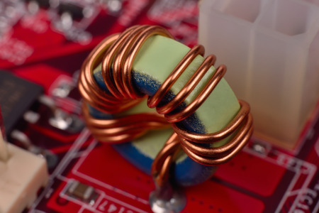 ferrite ring on red circuit board, close upの写真素材