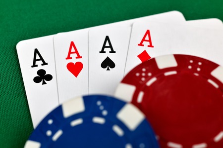 four aces and poker chips, close up