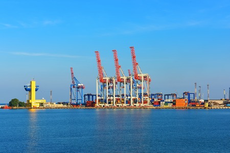 tall orange industrial cranes in the port of Odessaの写真素材