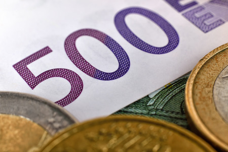 Euro coins and euro banknotes, close up