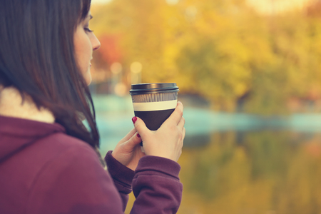 hipster girl drinking coffee. Vintage photoの写真素材