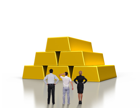 businesspeople looking on stacks of gold ingotsの写真素材