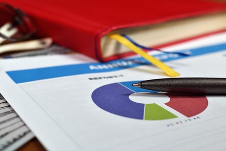 Report on Business Start up, and pen on tableの写真素材