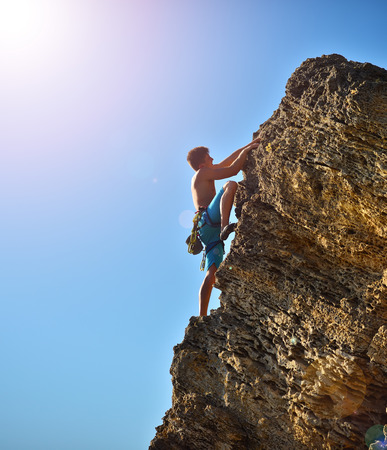 Male climber in mountains. Travel and tourism concept.の写真素材