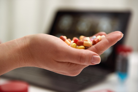 Color tablet in female doctor hand. close upの写真素材