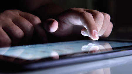 Businessman hands checking financial report on  digital tablet screen. Global business and trade...