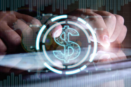 Businessman hands analyzing annual report on digital tablet screen with dollar hologram. Finance and...