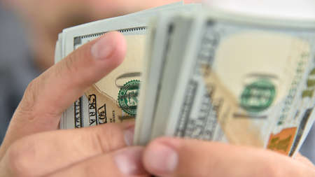 Hands count money bills. Starting investment capital. Finance and trade concept.