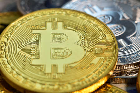 Golden and silver coins with bitcoin symbol. Cryptocurrency and payment concept. Close upの写真素材