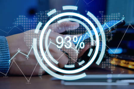 Businessman hands using mobile phone with percent statistics hologram. Finance and trade concept....