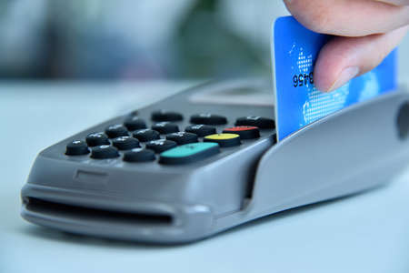 Pay money credit card for spending money with pos terminal. Transaction pay and payment concept. ...