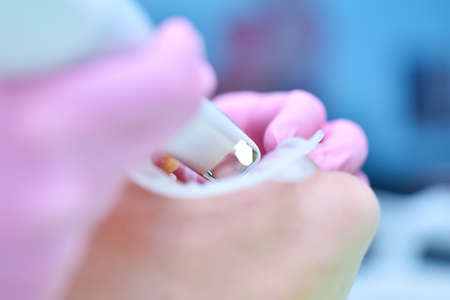 Dentist scaning patient's teeth with dental 3d scanner and screen with 3d scanning of jaw. Modern...