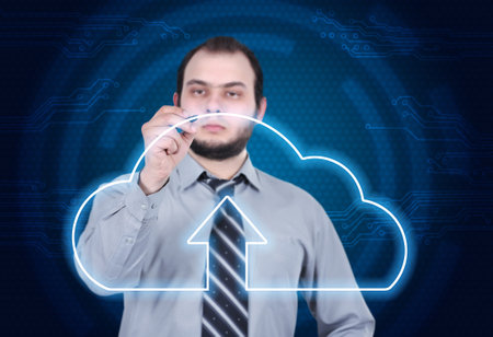 Businessman drawing on HUD digital display with cloud computing interface. Global business and...
