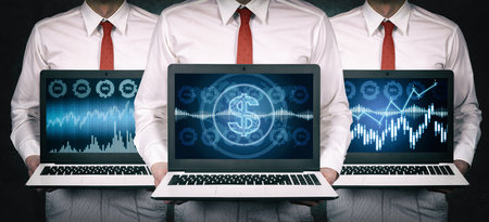 Three businessmen holding laptop with stock charts and analytics data. Trade and finance concept. Close upの写真素材