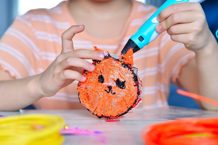 Girl designer using 3d printing pen at home. Creativity and innovation in art concept. Close up