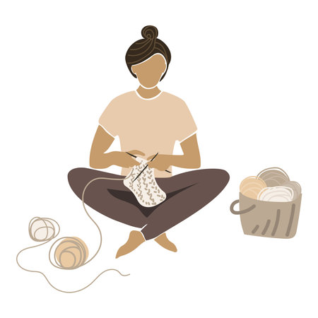 Young woman knitting with knitting needles sitting cross-legged, basket of yarn and balls of thread vector flat illustration in organic color.Handcraft Hobby Concept.home needlework.のイラスト素材