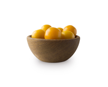 Bowl with yellow plums (cherry-plum) isolated on white background. Ripe plums with copy space for text.の写真素材