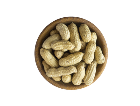 Peanut inshell on a white background. Top view. Peanut in a bowl isolated on white background. Peanut with copy space for text.の写真素材