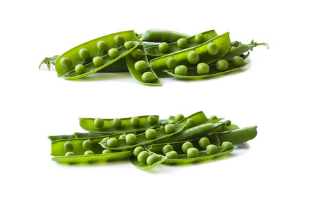 Set of green peas. Green peas isolated on a white background. Vegetables with copy space for text. Fresh green peas on a white background. Studio photo. Isolated macro food photo close up from above on white background.の写真素材