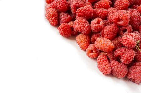 Background of raspberries. Fresh raspberries closeup on white background. Top view. Background of...