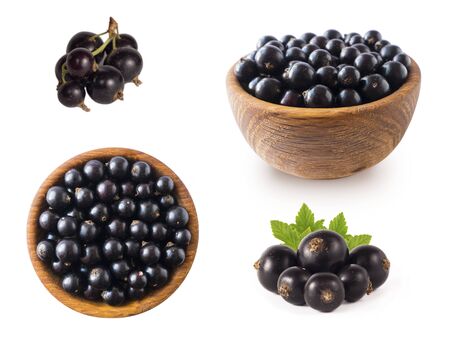 Black berries on white. Blackcurrants in a wooden bowl isolated on white background. Blackcurrant isolate. Blackcurrants isolated on white background. Top view. Berries from different angles on white.の写真素材