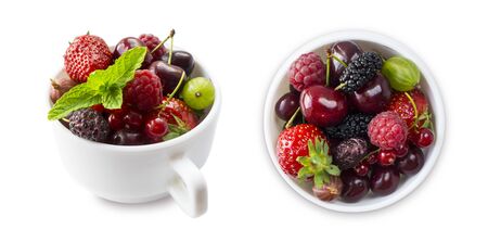 Top view.Fruits and berries in bowl isolated on white background. Mixed fruits with copy space for text. Mixed berries isolated on a white background.Fruits and berries from different angles on white.の写真素材