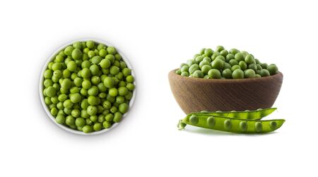Green peas on a wooden bowl isolated on a white background. Vegetables with copy space for text. Green peas isolated on white. Isolated macro food photo close up from above on white background.の写真素材