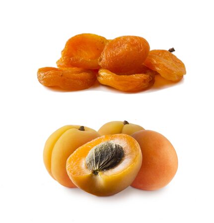 Ripe and dried apricots. Fresh and dried apricots isolate on white background. Apricots and dried apricots with copy space for text. Immunity system improvement. Antiviral treatment.  Coronavirus prevention.の写真素材