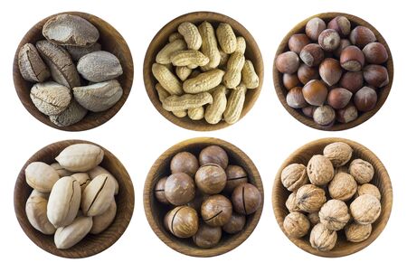 Set of nuts isolated on white background. Superfood with copy space for text. Brazil nut, peanuts, hazelnuts, macadamia, walnuts, pecans. Top view. Nuts collection on a white background の写真素材