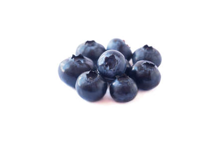 Blueberries isolation. Ripe blueberries with copy space for text. Heap of blueberry isolated on white. Bilberries on a white background. Blueberries on a white background.の写真素材