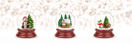 Christmas snow ball or glass globe isolated on white. Can be used as a Christmas or a New Year gift or symbol. Christmas and New Year design element. Toy glass snow globe with snowman, bear and houseの写真素材