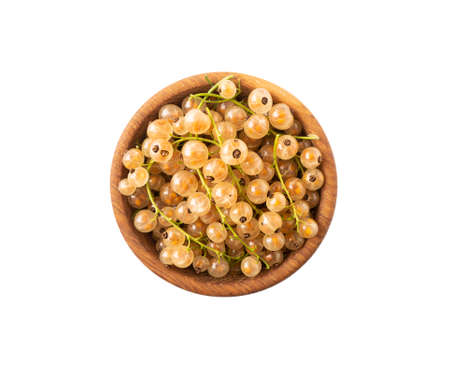 Currant isolated on white background cutout. White currant in a wooden bowl with copy space for text. Top view.の写真素材